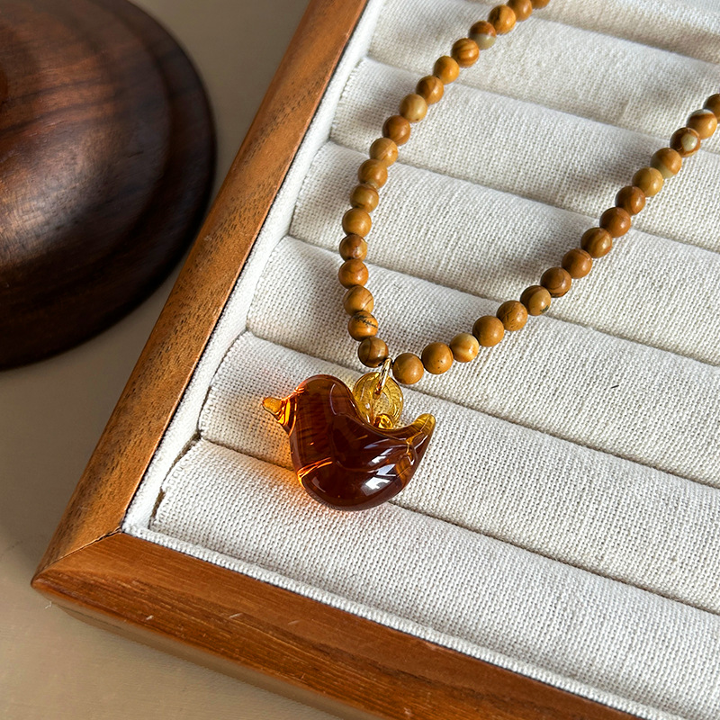 Houten kralen glazen vogelkett - Vintage Vibes Fashion recensie en prijs